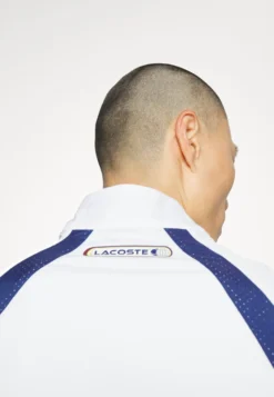 Lacoste Sport Tracksuit - Trainingspak - White/Limeira Zin Methylene -Lacoste Sport 35d65f66e5cb441da5a587b2dd8ebf2a scaled