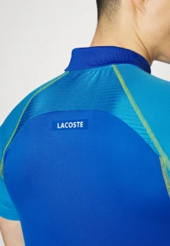 Lacoste Sport Tennis Tour - Poloshirt - Bleu Jaune -Lacoste Sport 83c23a0936794774b8b8d261f479ec84 scaled