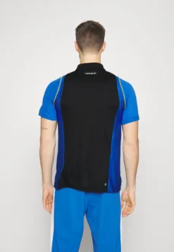 Lacoste Sport Tennis Tour - Poloshirt - Noir/Bleu/Jaune -Lacoste Sport 9efb643fc5b048a984660efec6f7bdf6 scaled