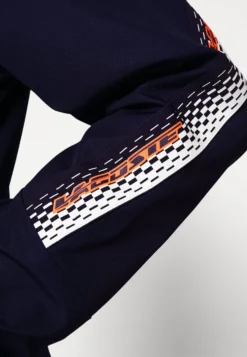 Lacoste Sport Tennis Jacket Tapered - Trainingsvest - Navy Blue/Flashy Orange Flourecend -Lacoste Sport c92c9884e56c4bddb645ae0f6987eb7f scaled