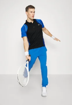 Lacoste Sport Tennis Tour - Poloshirt - Noir/Bleu/Jaune -Lacoste Sport e3c19bd2b1ca4225b5b1e800d30e2cae scaled