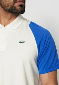 Lacoste Sport Tennis - Poloshirt - Flour/Kingdom/Flashy Orange -Lacoste Sport ef62676ca78e44a49276460dee498233 scaled